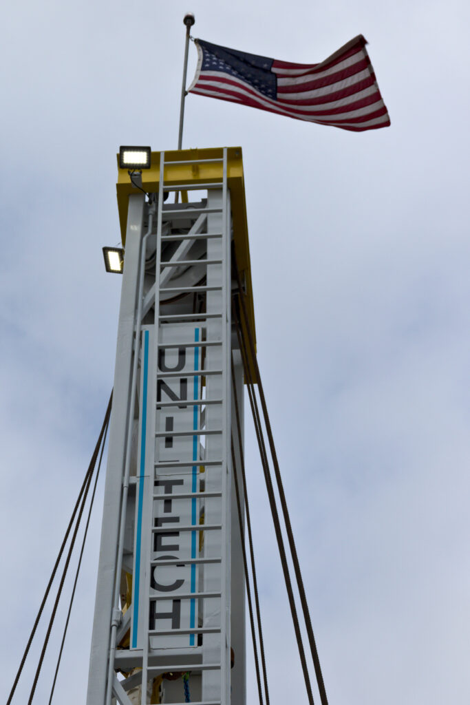 Drill rig with uni-tech and flag